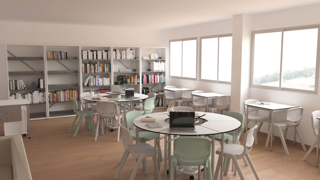 Une bibliothèque ou une salle de classe lumineuse avec des tables rondes, des chaises pastel, des étagères remplies de livres et de grandes fenêtres laissant entrer la lumière naturelle. Des ordinateurs portables et des livres sont posés sur certaines tables.