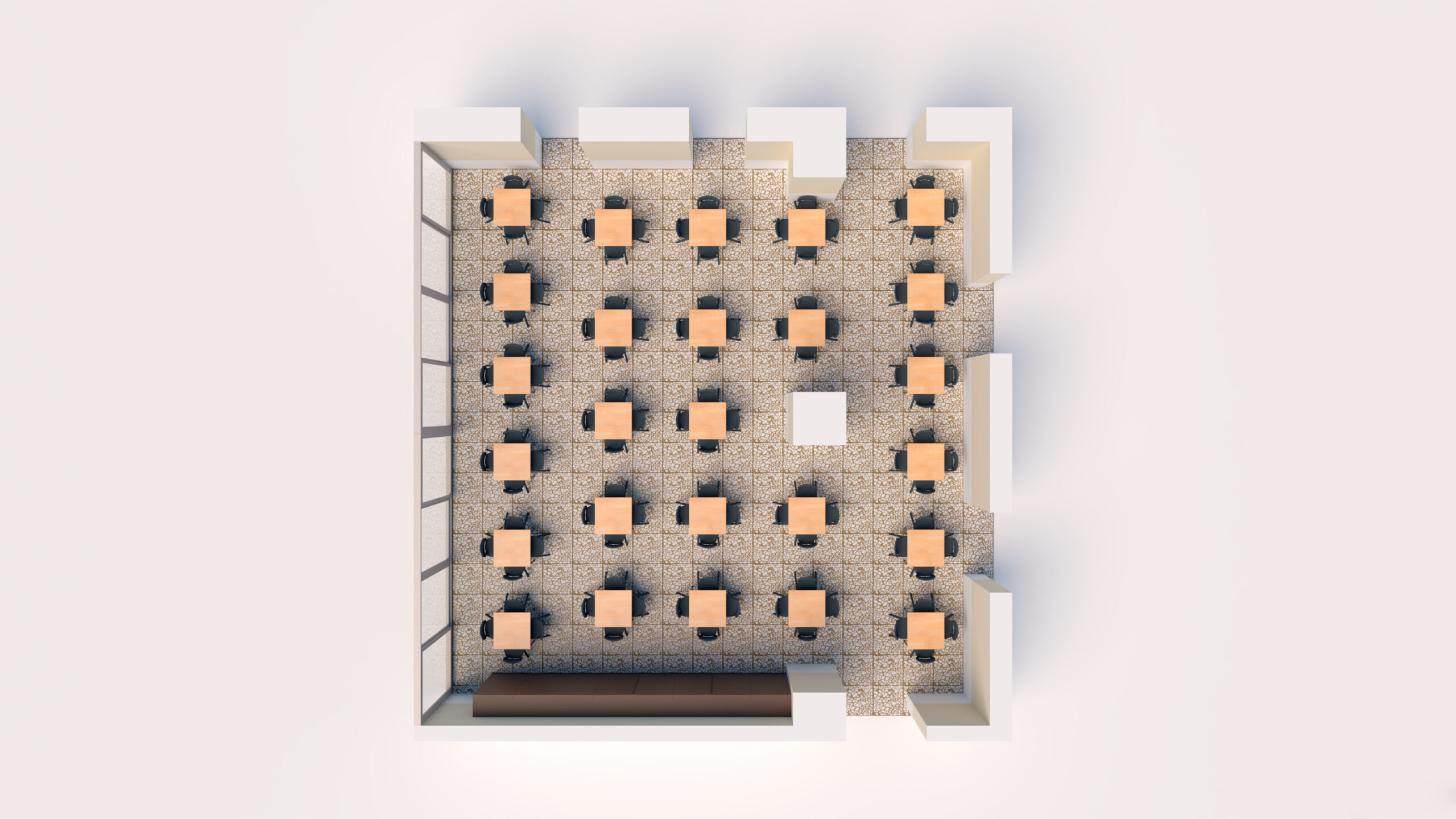 Vue de haut en bas d'une salle de classe composée de six rangées de quatre bureaux chacune, disposées en grille. Le bureau de l'enseignant se trouve à l'avant et de grandes fenêtres sont disposées le long d'un mur. Un sol à motifs est visible dans toute la salle.