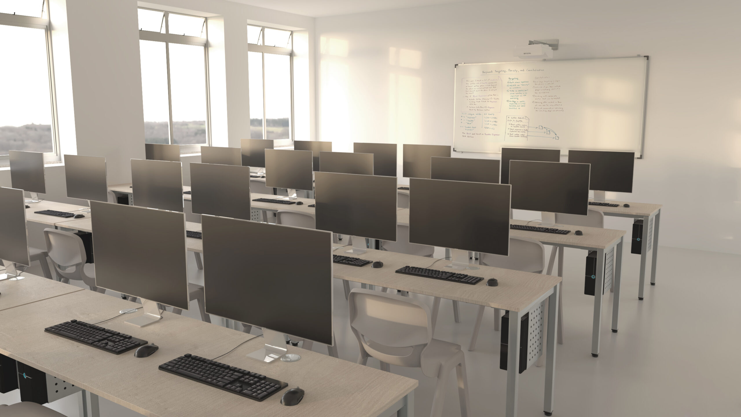 Une salle informatique moderne avec des rangées de bureaux, chacun équipé d'un écran, d'un clavier et d'une souris. De grandes fenêtres laissent entrer la lumière naturelle et un tableau blanc avec des écritures est suspendu à l'avant de la salle.